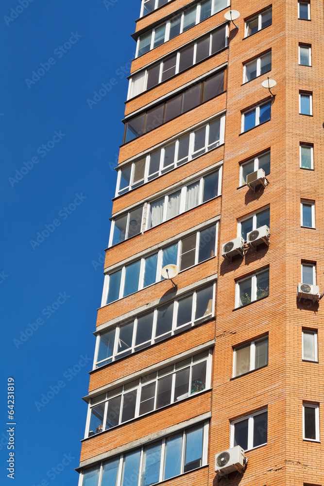 blue sky and wall of multistorey house