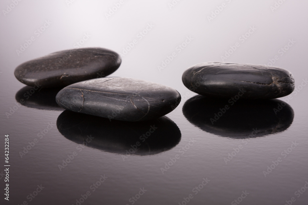 Spa stone arrangement on black surface Spa stone arrangement on black surface
