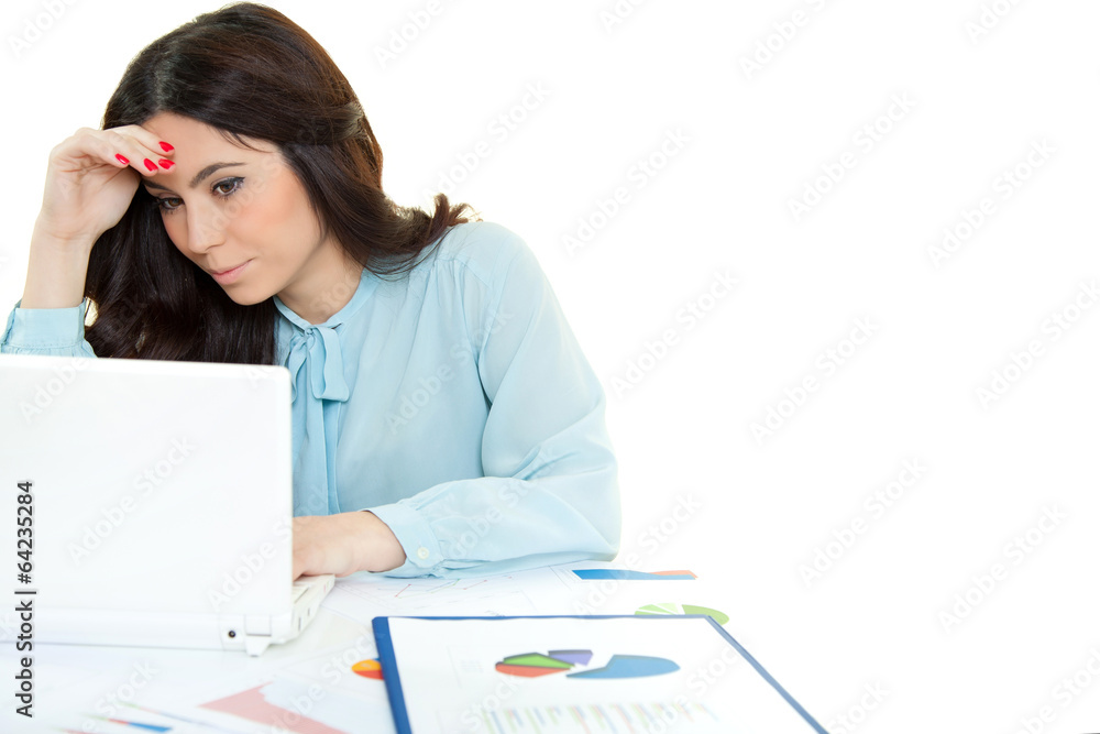 Beautiful business woman dreaming while working on computer