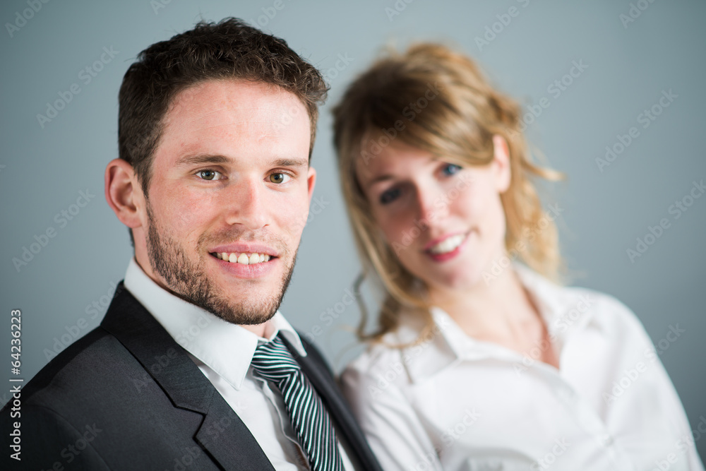 handsome young executive business man with female coworker handsome young executive business man with female coworker