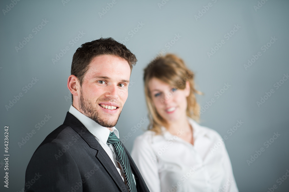 handsome young executive business man with female coworker handsome young executive business man with female coworker