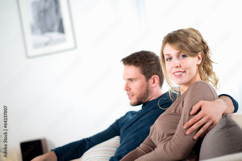 portrait of a cheerful young couple relaxed at home portrait of a cheerful young couple relaxed at home