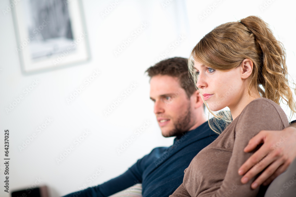 portrait of a cheerful young couple relaxed at home portrait of a cheerful young couple relaxed at home