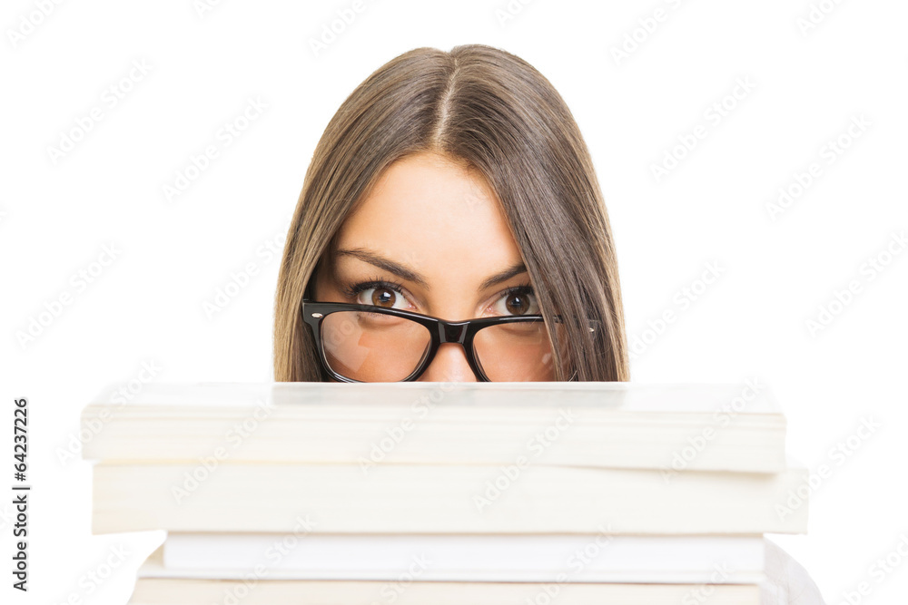 Student girl with glasses hiding behind books Student girl with glasses hiding behind books