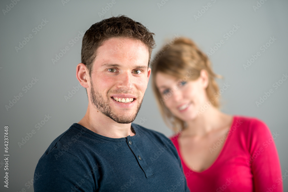 portrait of a cheerful young couple relaxed at home portrait of a cheerful young couple relaxed at home