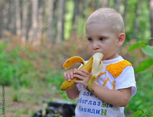 boy eats a banana