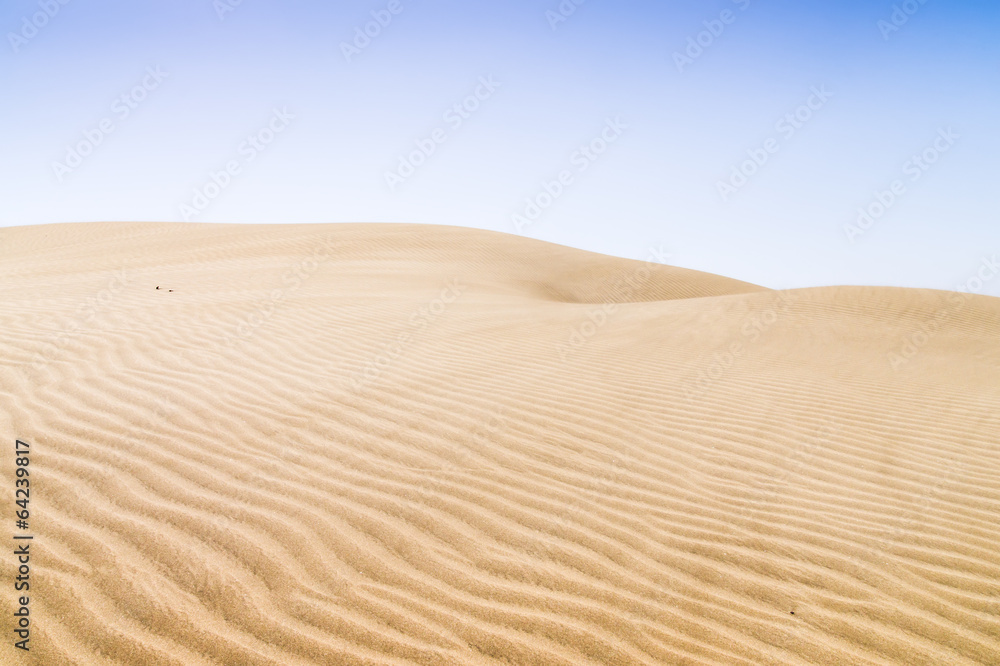 Sand dunes on the beach in Maspalomas. Sand dunes on the beach in Maspalomas.
