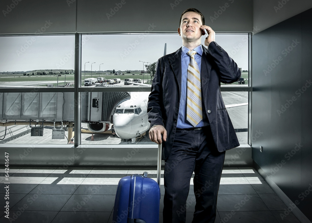 Businessman with baggage in airport Businessman with baggage in airport
