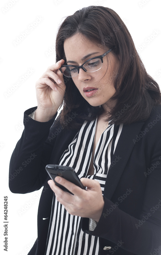 Businesswoman looking mobile phone Businesswoman looking mobile phone