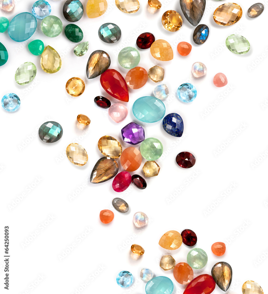 Many colorful real gemstones on the white background. Many colorful real gemstones on the white background.