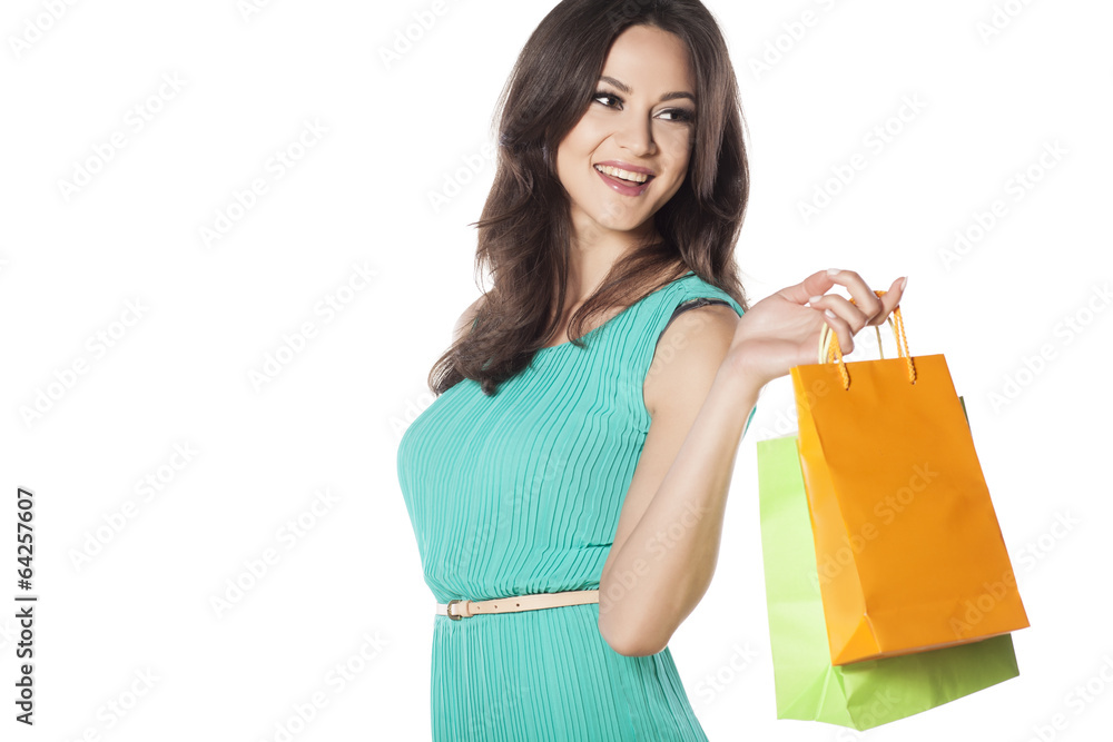 smiling beautiful girl with the shopping bags in her hand smiling beautiful girl with the shopping bags in her hand