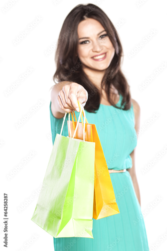 smiling beautiful girl with the shopping bags in her hand smiling beautiful girl with the shopping bags in her hand
