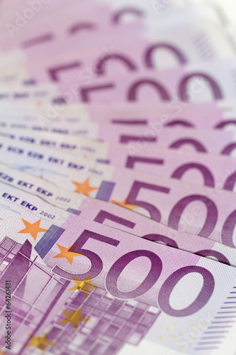 Vertical isometric stack of money with 500 euro banknotes.