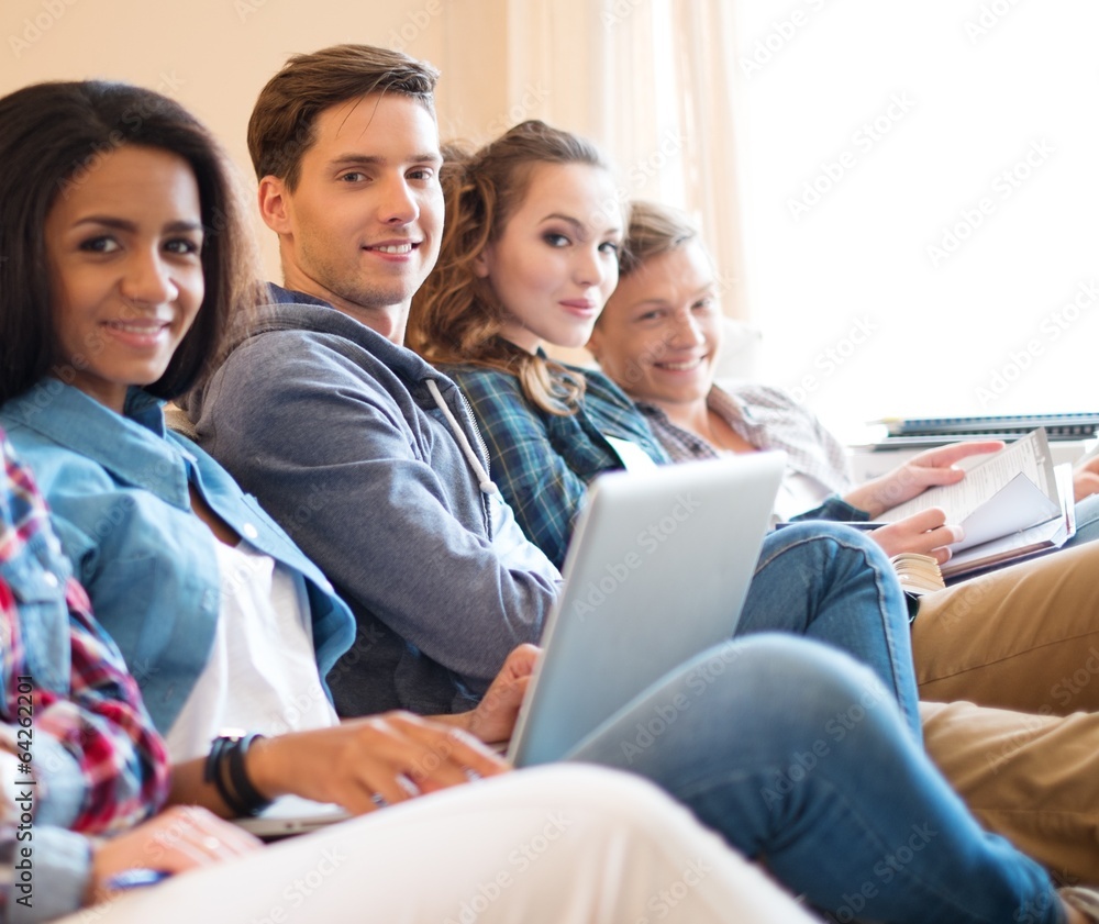 Group of students preparing for exams in apartment interior Group of students preparing for exams in apartment interior