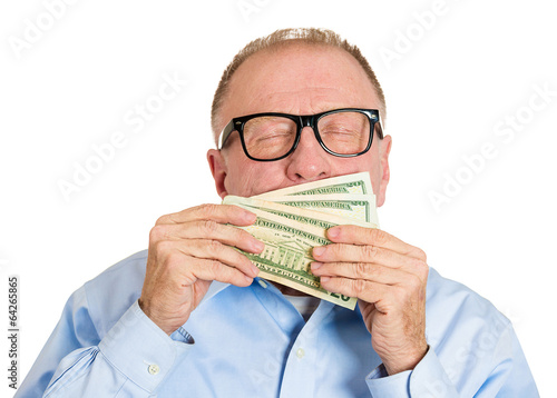 Portrait, headshot Stingy senior man, holding, smelling money