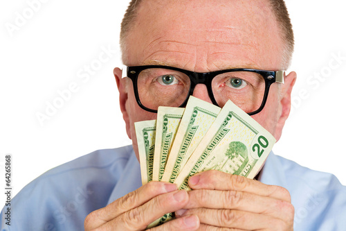 Portrait, headshot Stingy senior man, holding, smelling money