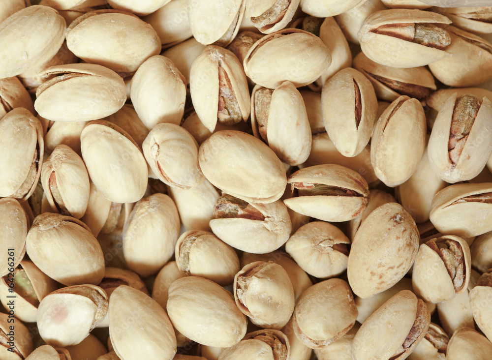 Closeup of pistachios in nut shells as food background Closeup of pistachios in nut shells as food background