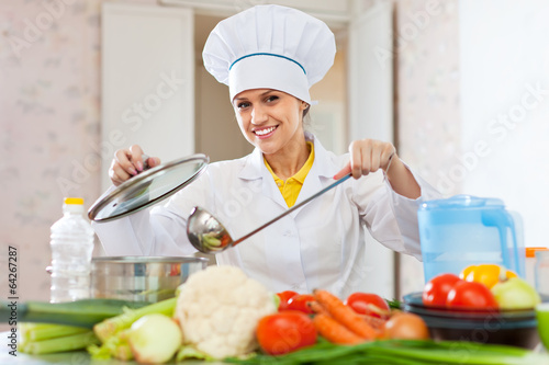 Professional cook in white hat photo