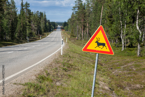 Beautiful scenic road in Norway. Typical warning road sign