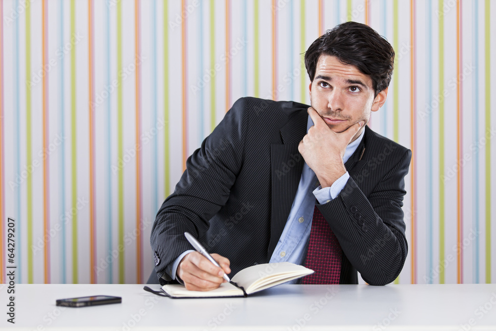 Businessman writing documents