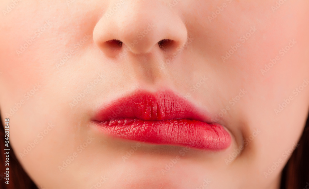 Fototapeta premium Beautiful woman red lips close up