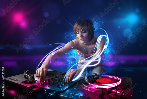 Disc jockey playing music with electro light effects and lights © ra2 studio