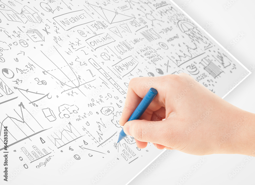 Human hand sketching ideas on a white paper Human hand sketching ideas on a white paper