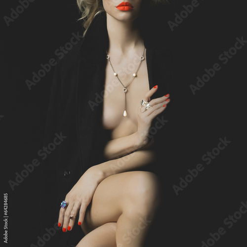 Nude beauty with bright makeup and jewelry photo