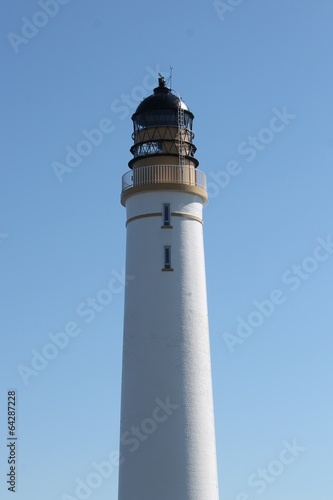 White-painted brick lighthouse tower