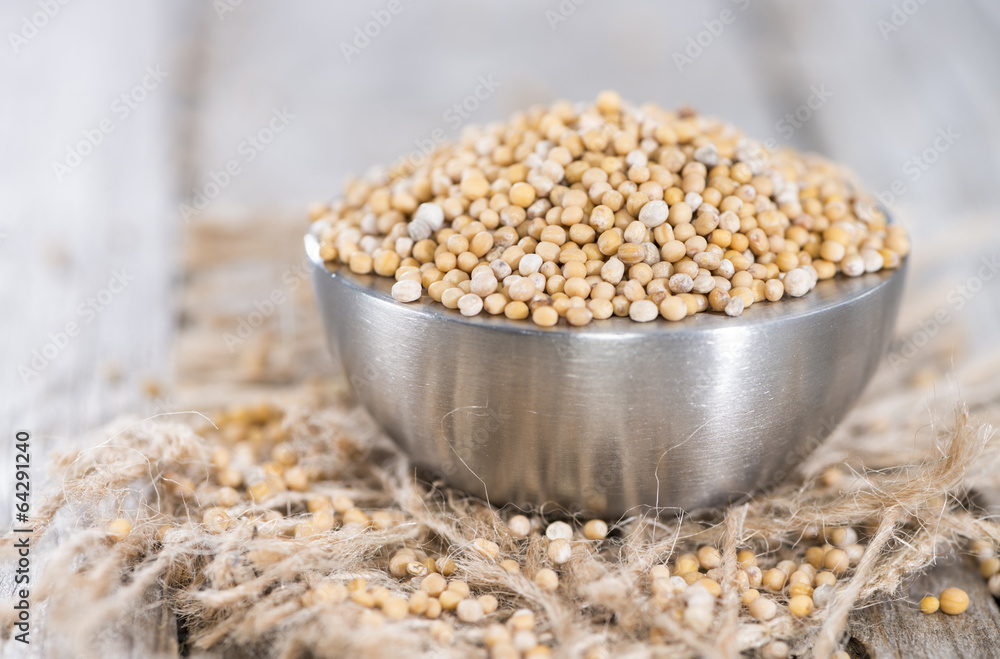 Mustard Seeds (on wooden background) Mustard Seeds (on wooden background)