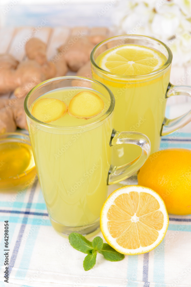 Healthy ginger tea with lemon and honey on table close-up Healthy ginger tea with lemon and honey on table close-up