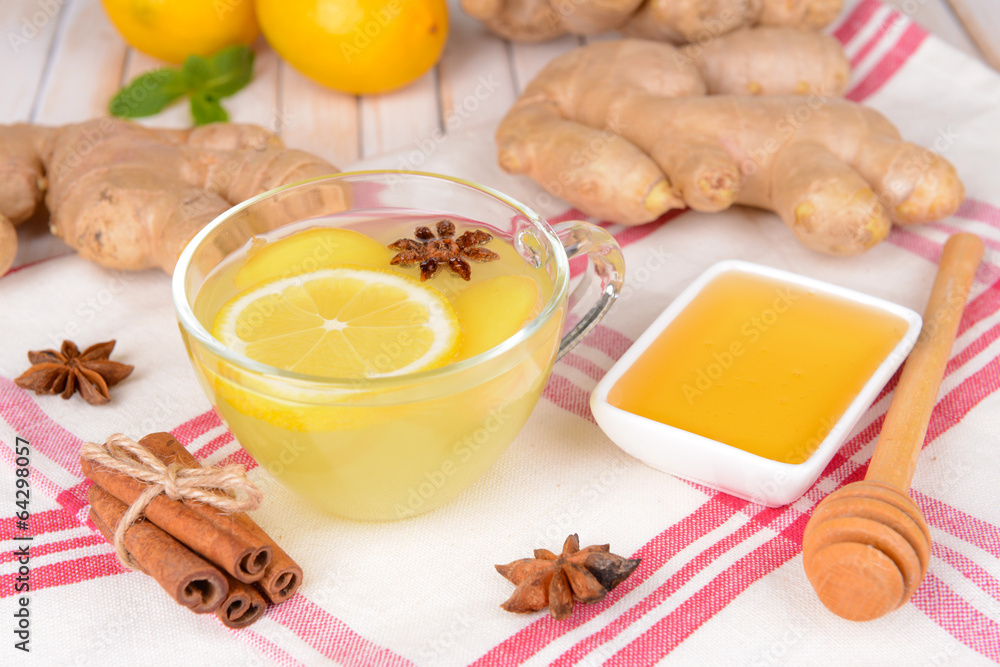 Healthy ginger tea with lemon and honey on table close-up Healthy ginger tea with lemon and honey on table close-up