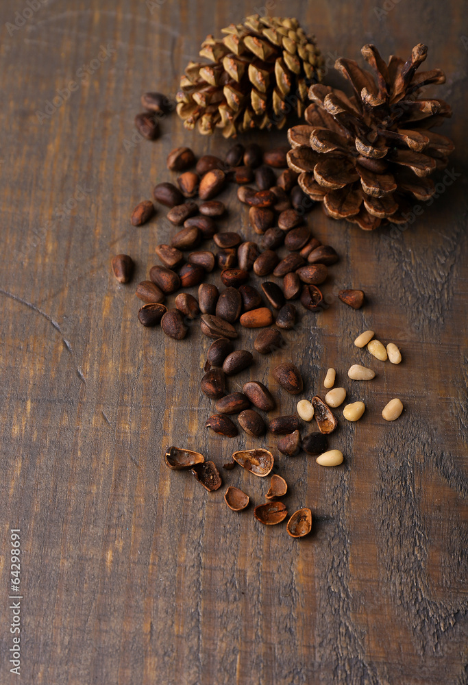 Cedar pine nuts on wooden table Cedar pine nuts on wooden table