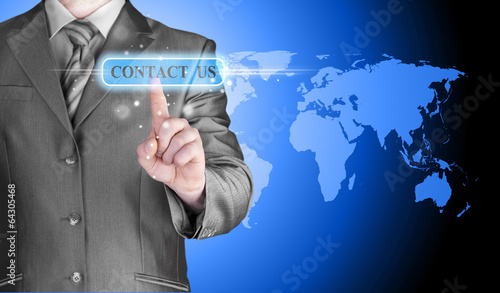 businessman hand pushing contact us button