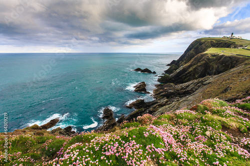 Cliff under cloudy sky