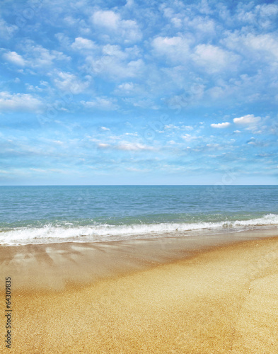 Golden sand, blue sea and sky. Beach