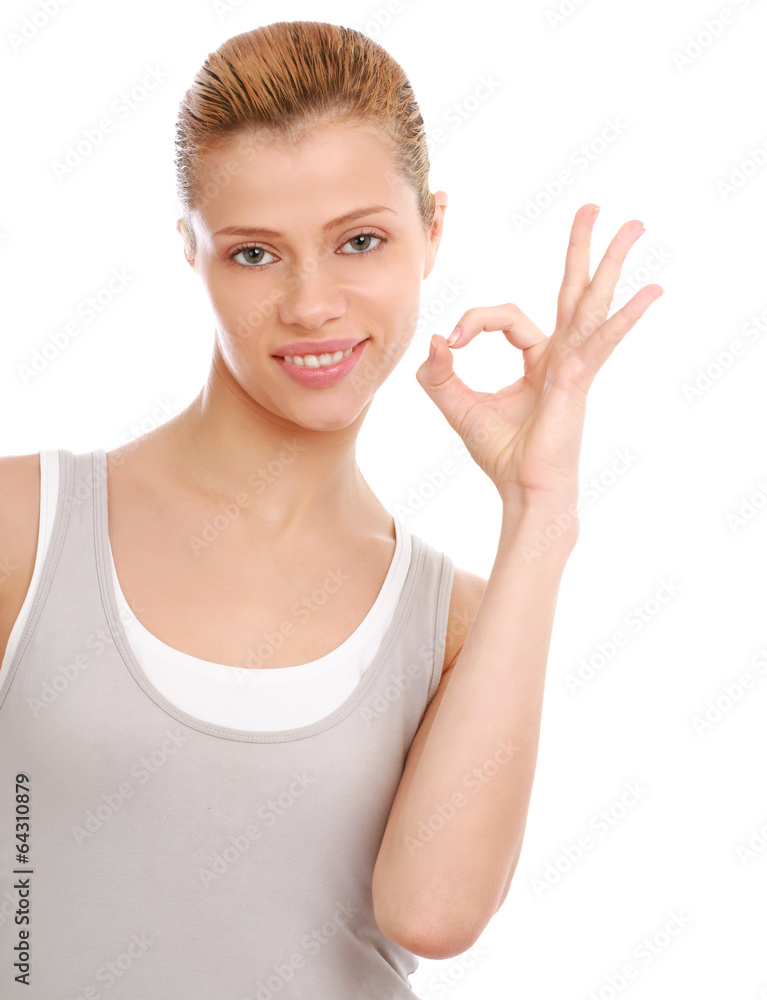Portrait of a beautiful young woman showing ok Portrait of a beautiful young woman showing ok