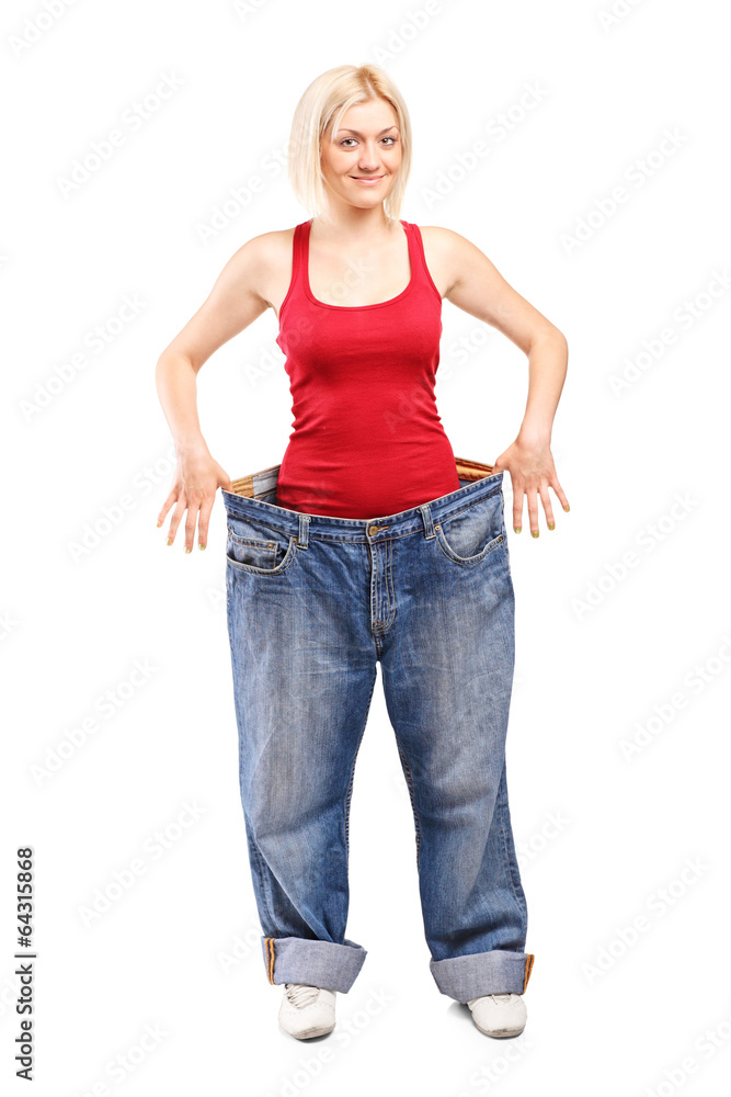 Woman standing in a pair of oversized jeans Woman standing in a pair of oversized jeans