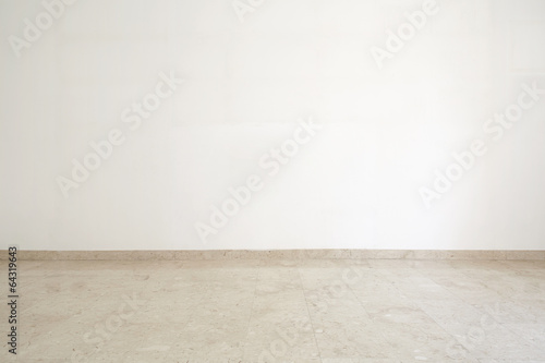 Empty room with marble floor and white wall