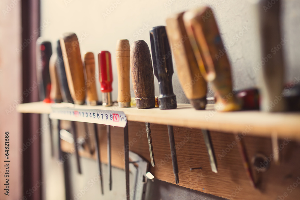 Old woodworking tools on wall, retro tinted Old woodworking tools on wall, retro tinted