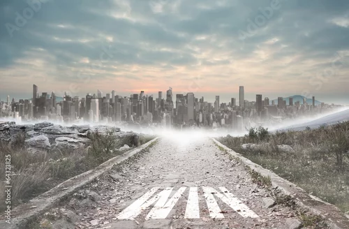 Obraz Wygraj z kamienistą ścieżką prowadzącą do dużego miasta na horyzoncie