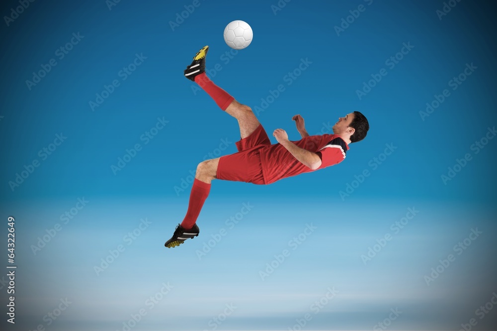 Composite image of football player in red kicking Composite image of football player in red kicking