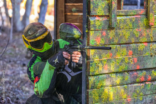 shooter behind fortification with paint splashes photo