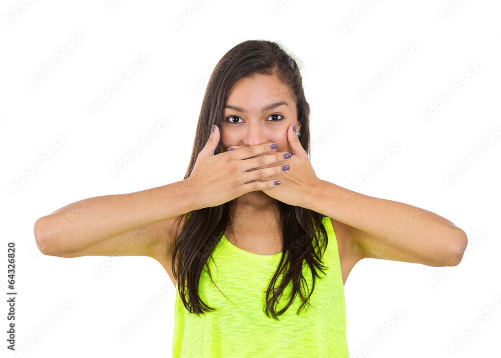 Fototapeta premium speak no evil concept. Young woman covering mouth with hands 