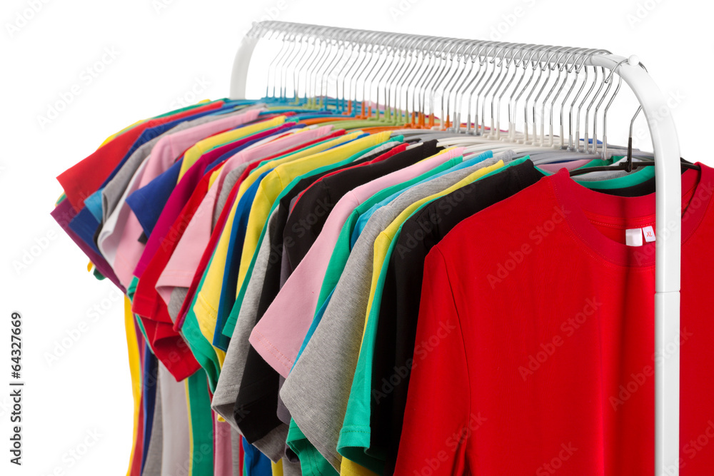 Obraz premium Colored shirts on hangers steel.