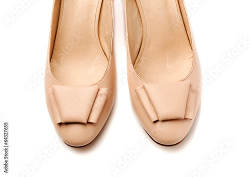Pair of women's shoes leather beige closeup.