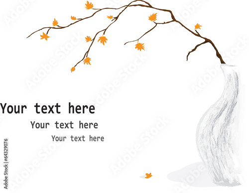 branch with falling yellow leaves in a vase