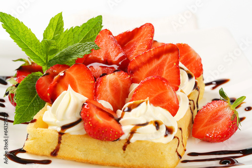 Crisp waffle with  strawberries and cream