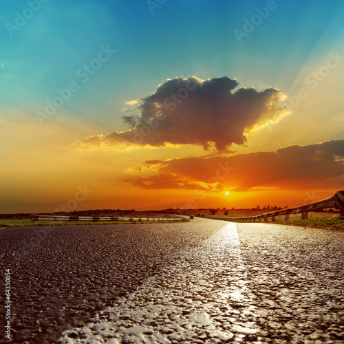 fantastic sunset over asphalt road