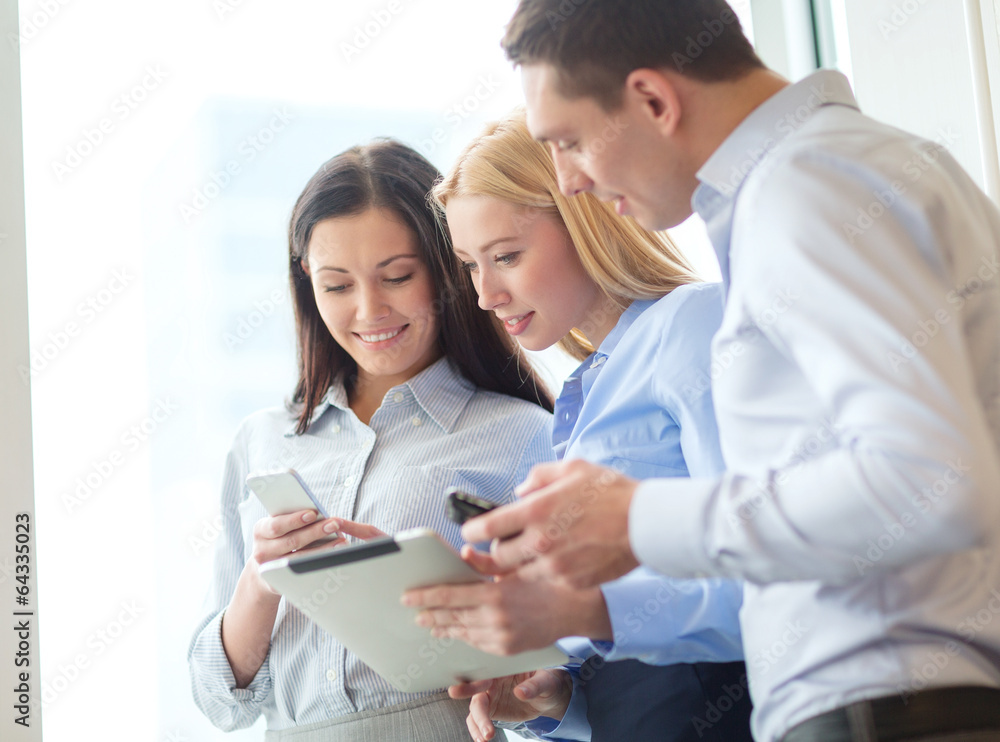 business team working with tablet pcs in office business team working with tablet pcs in office
